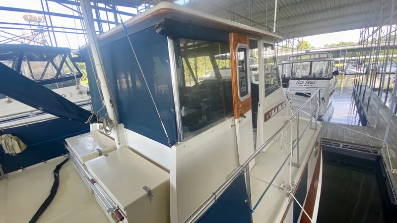 Slide: The Image of 1989 Kadey-Krogen Manatee 36 docked in a covered marina. - 23