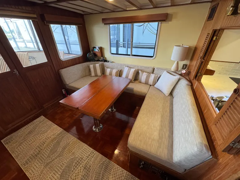 Slide: The Image of Interior of 1989 Kadey-Krogen Manatee 36 with cozy seating and wooden table. - 33