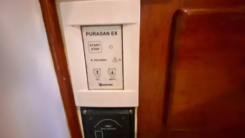 Slide: The Image of Control panel on a 1989 Kadey-Krogen Manatee 36 boat, featuring Purasan EX system. - 42