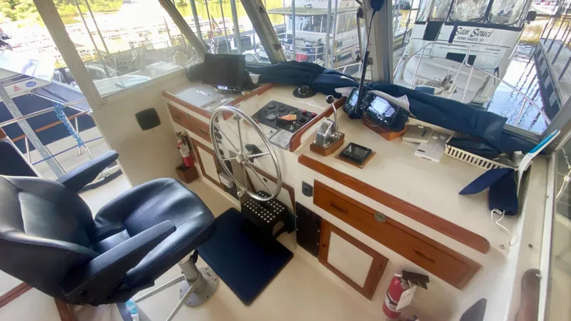 Slide: The Image of 1989 Kadey-Krogen Manatee 36 helm with navigation equipment and captain's chair. - 48