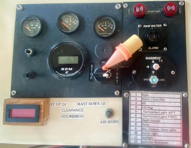 Slide: The Image of Control panel of a 1989 Kadey-Krogen Manatee 36 boat with gauges and switches. - 49