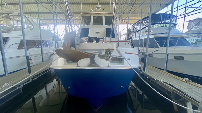 Slide: The Image of 1989 Kadey-Krogen Manatee 36 yacht docked in a marina, front view. - 8