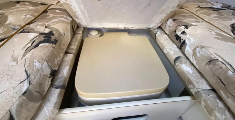 Slide: The Image of Interior of 2000 Sea Ray 230 boat with built-in storage compartment. - 13