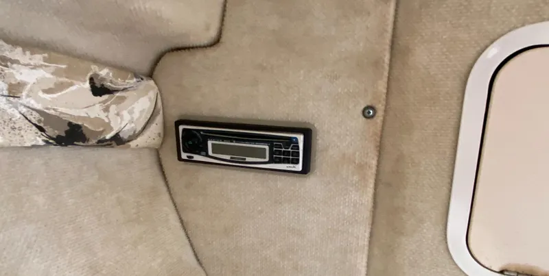 Slide: The Image of Interior of 2000 Sea Ray 230 boat with built-in stereo system. - 14