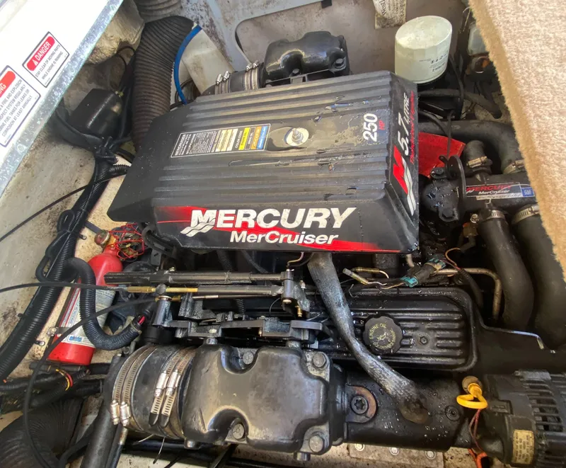 Slide: The Image of Mercury MerCruiser engine in a 2000 Sea Ray 230 boat, showcasing detailed components. - 16