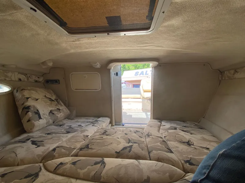 Slide: The Image of Interior cabin of a 2000 Sea Ray 230 boat with floral upholstery. - 9