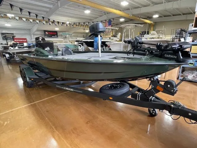 Slide: The Image of 2025 Vexus AVX 1980 boat in showroom, featuring Garmin equipment and sleek design. - 1