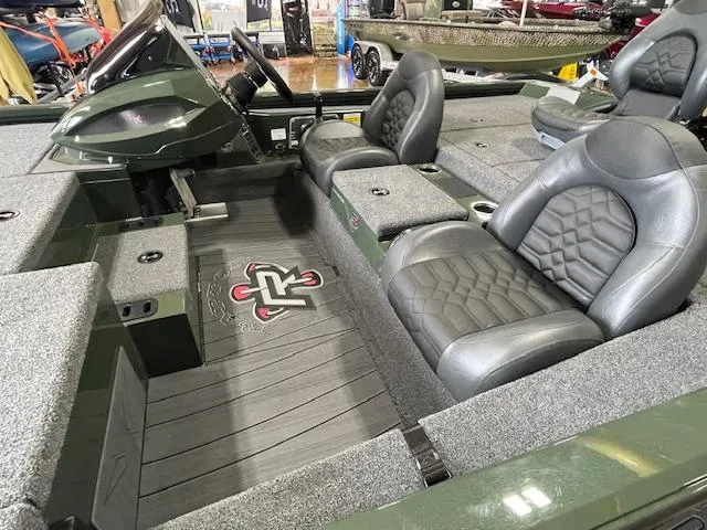 Slide: The Image of 2025 Vexus AVX 1980 boat interior with gray seating and carpeted flooring. - 2