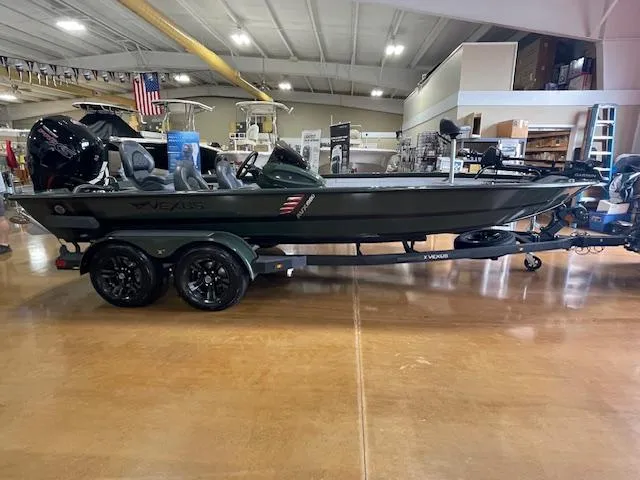 Slide: The Image of 2025 Vexus AVX 1980 boat displayed indoors on a trailer. - 4