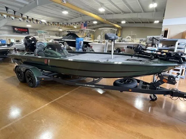 Slide: The Image of 2025 Vexus AVX 1980 boat displayed indoors on a trailer. - 5