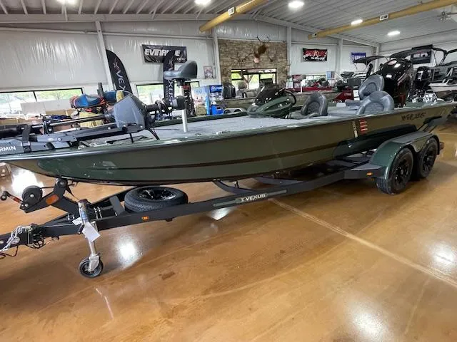 Slide: The Image of 2025 Vexus AVX 1980 boat on trailer in showroom, featuring sleek design and modern equipment. - 6