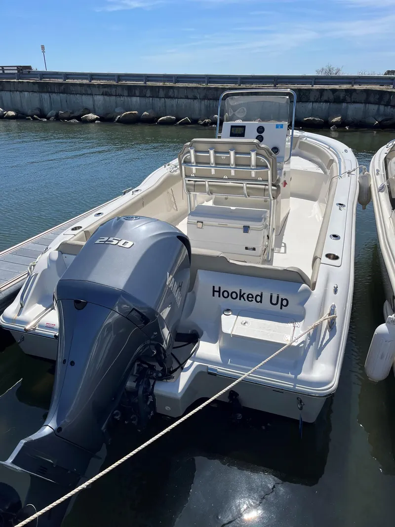 Slide: The Image of 2023 Key West 239 FS boat docked with Yamaha 250 engine. - 2