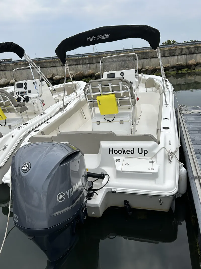 Slide: The Image of 2023 Key West 239 FS boat docked, featuring Yamaha outboard motor and "Hooked Up" name. - 3