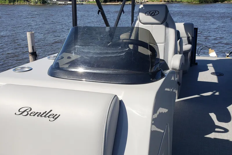 Slide: The Image of 2025 Bentley Pontoons Legacy 243 Navigator Ext on a sunny lake. - 3