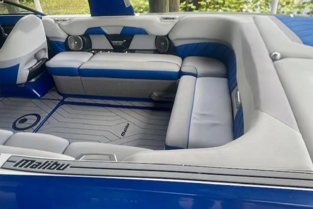Slide: The Image of Interior of 2016 Malibu Wakesetter 25 LSV boat with blue and gray seating. - 10