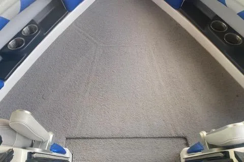Slide: The Image of Interior of 2016 Malibu Wakesetter 25 LSV boat with gray carpet and cup holders. - 11