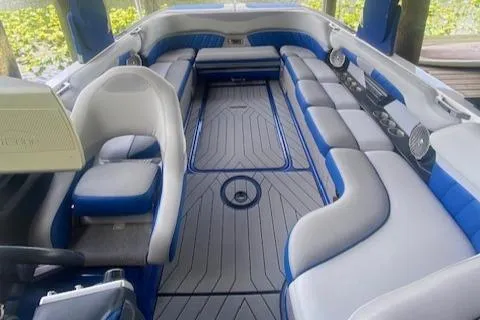 Slide: The Image of 2016 Malibu Wakesetter 25 LSV interior with blue and gray seating, spacious layout. - 13