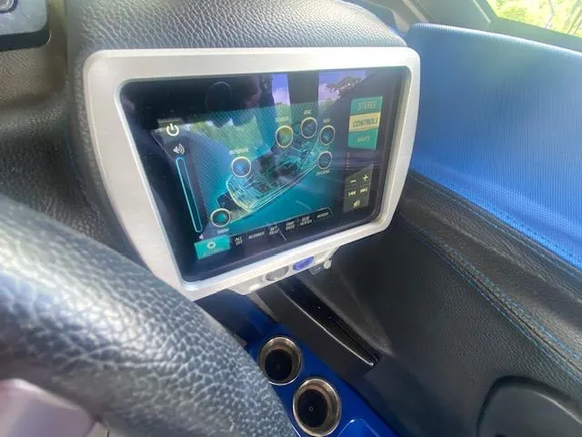 Slide: The Image of Touchscreen control panel in a 2016 Malibu Wakesetter 25 LSV boat interior. - 24