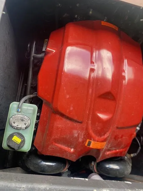 Slide: The Image of Engine compartment of a 2016 Malibu Wakesetter 25 LSV with red engine cover. - 6