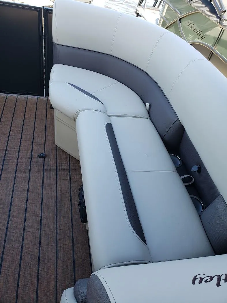 Slide: The Image of 2025 Bentley Pontoons Legacy Navigator interior seating with elegant design and premium materials. - 3