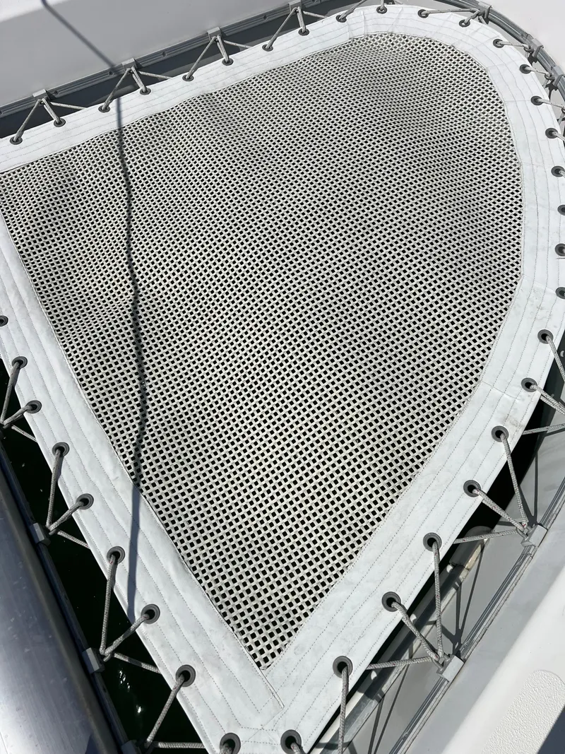 Slide: The Image of Trampoline netting on a 1996 Prout 45 catamaran, secured with ropes. - 10
