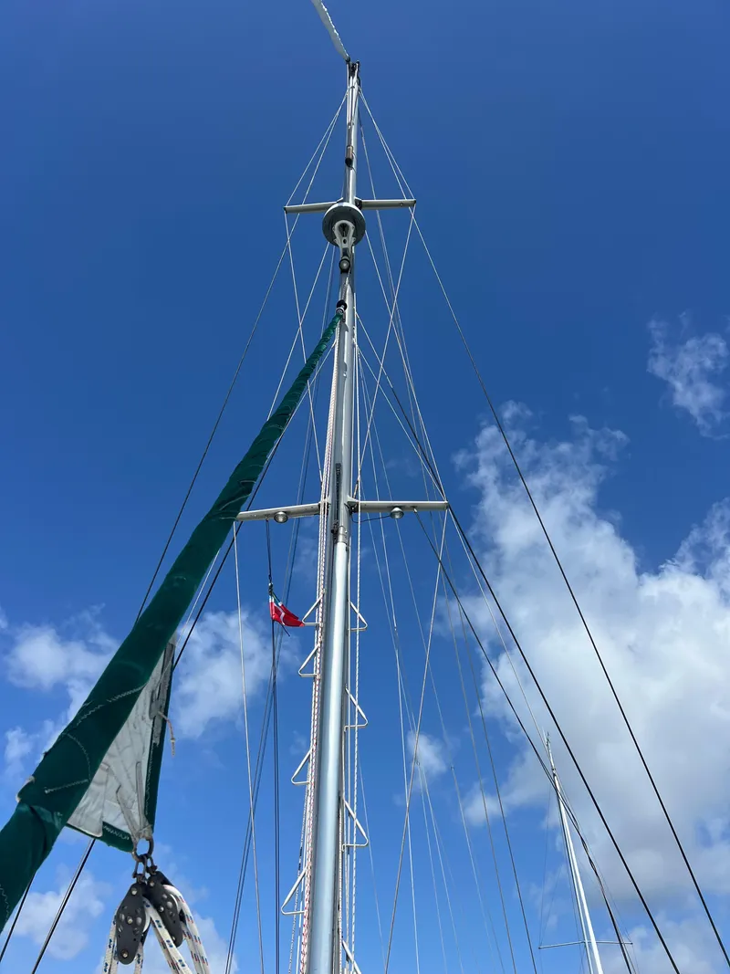 Slide: The Image of Sailboat mast of a 1996 Prout 45 against a clear blue sky. - 15