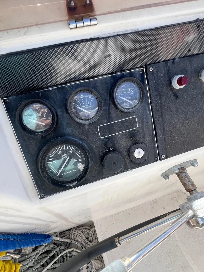 Slide: The Image of Control panel of a 1996 Prout 45 boat with gauges and switches. - 19