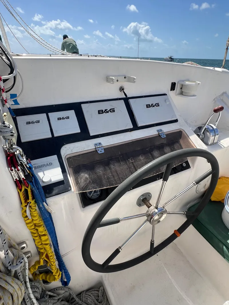 Slide: The Image of Sailboat cockpit with steering wheel, navigation instruments, and ropes; Prout 45, 1996 model. - 20