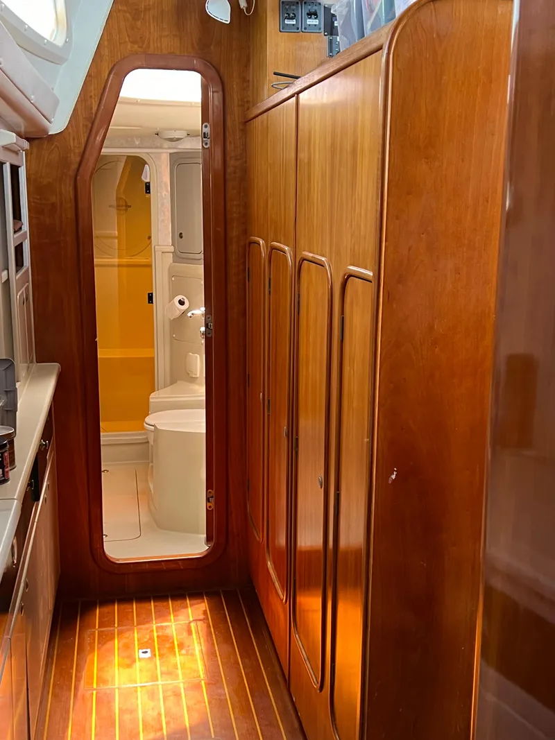 Slide: The Image of Interior of 1996 Prout 45 yacht with wooden cabinetry and visible bathroom. - 27