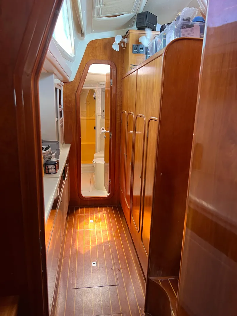 Slide: The Image of Interior of a 1996 Prout 45 yacht with wooden flooring and cabinetry. - 30