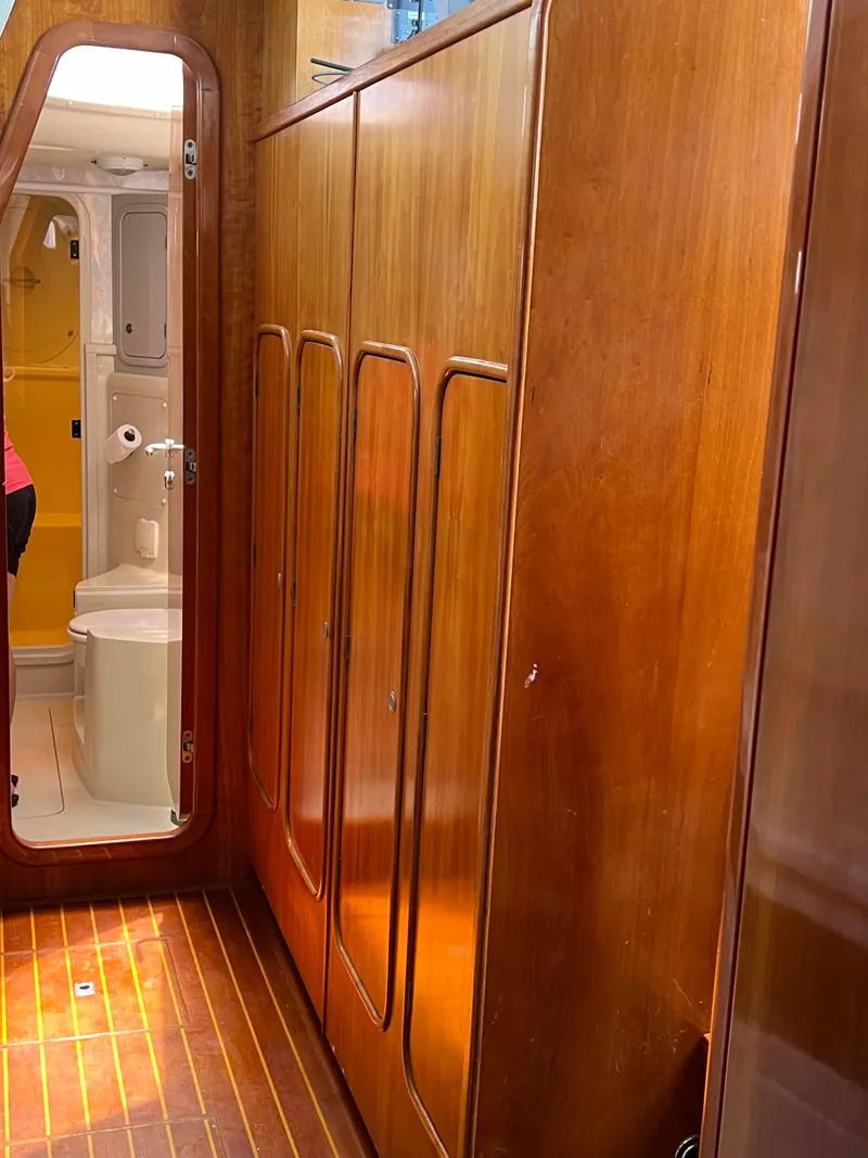 Slide: The Image of Interior of 1996 Prout 45 yacht with wooden cabinets and bathroom view. - 32
