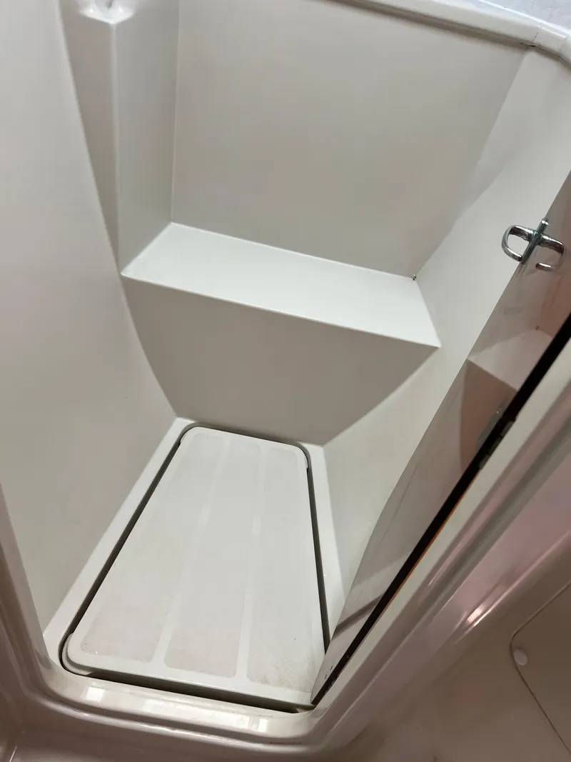 Slide: The Image of Compact shower area inside a 1996 Prout 45 boat, featuring a sleek, minimalist design. - 36