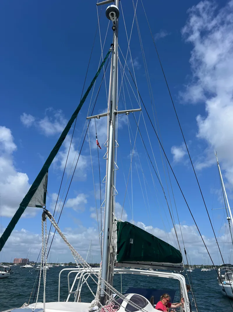 Slide: The Image of Sailboat Prout 45, 1996 model, with tall mast against blue sky and clouds. - 9
