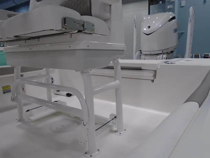 Slide: The Image of 2025 Caymas 24 HB boat interior with seating and motor, showcasing modern design and functionality. - 14