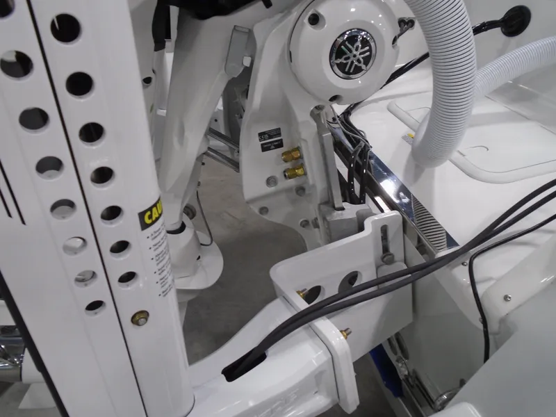 Slide: The Image of 2025 Caymas 24 HB boat engine and mechanical components close-up. - 25