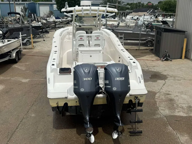 Slide: The Image of 2015 Sea Fox 286 Commander boat with dual Yamaha 300 engines, docked in a marina. - 3