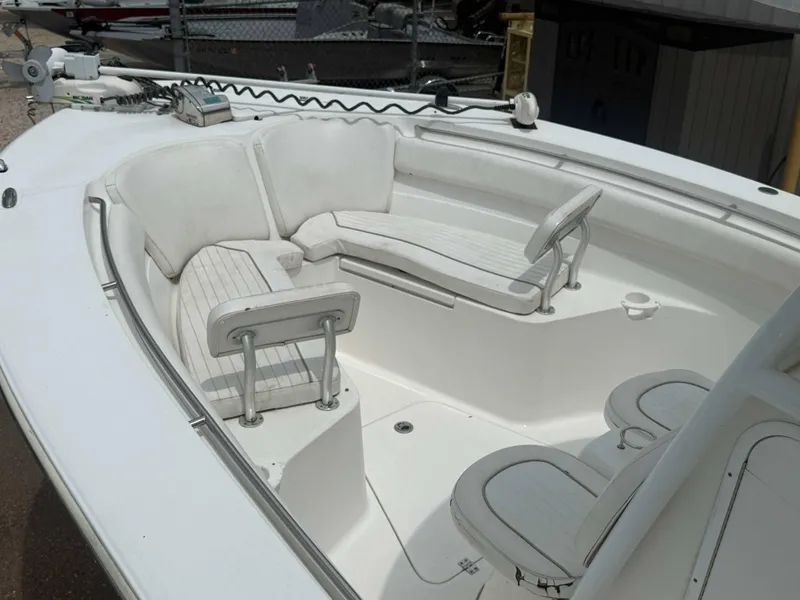 Slide: The Image of 2015 Sea Fox 286 Commander boat interior with white cushioned seating. - 4