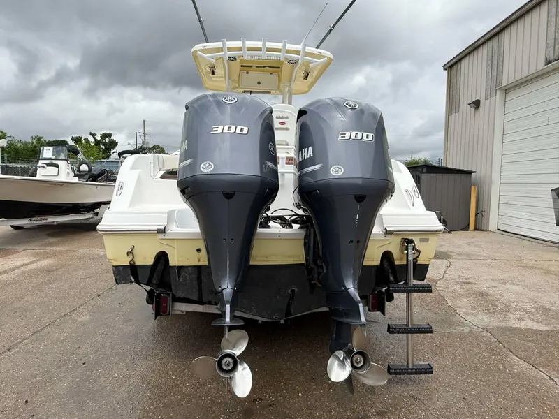 Slide: The Image of 2015 Sea Fox 286 Commander with twin Yamaha 300 engines, parked outdoors. - 6