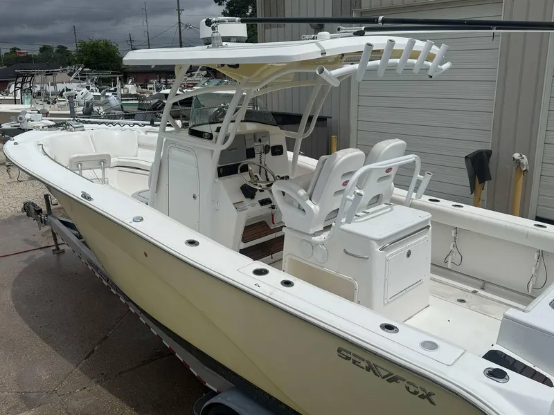 Slide: The Image of 2015 Sea Fox 286 Commander boat with dual seats and fishing rod holders. - 8