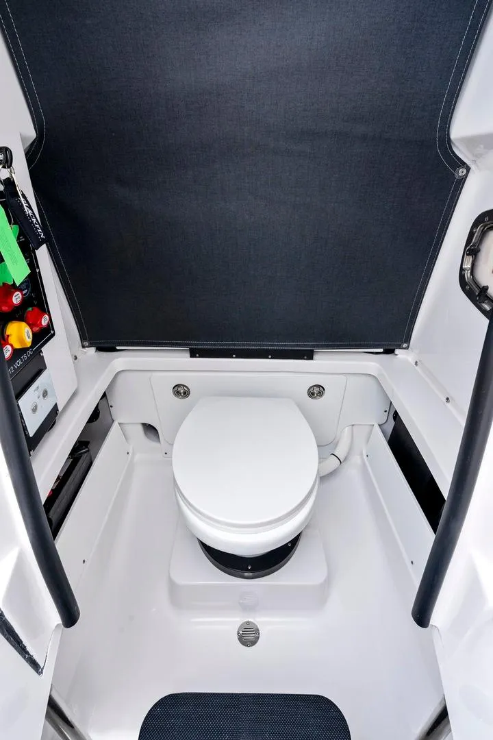 Slide: The Image of 2025 Blackfin 252 CC boat interior with compact marine toilet. - 10