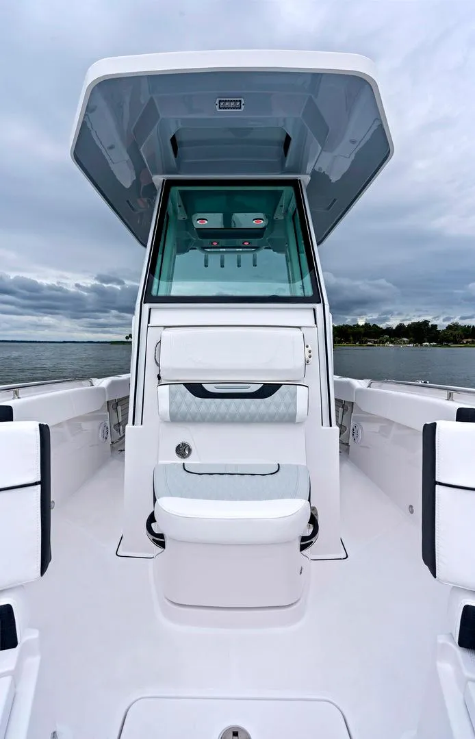 Slide: The Image of 2025 Blackfin 252 CC boat, sleek design, center console, open water background. - 9