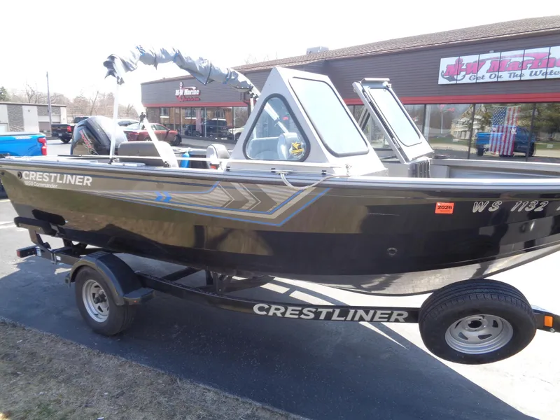 Slide: The Image of 2017 Crestliner CCM185 boat on trailer, parked outside a building. - 11