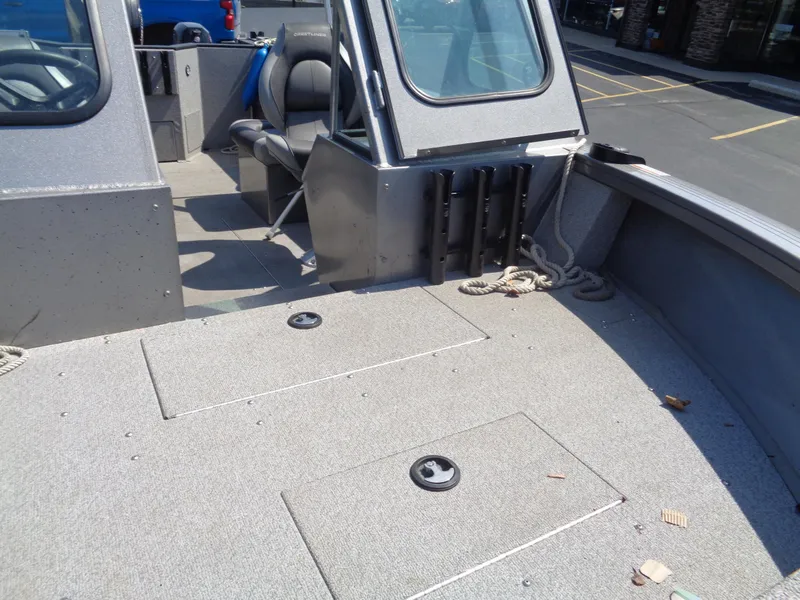 Slide: The Image of 2017 Crestliner CCM185 boat interior with seating and storage compartments. - 13