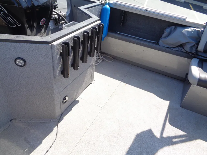 Slide: The Image of 2017 Crestliner CCM185 boat interior with rod holders and seating. - 15