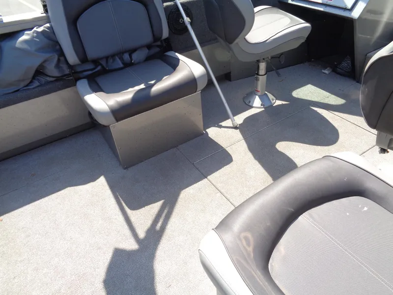 Slide: The Image of Interior of 2017 Crestliner CCM185 boat with gray seating and carpeted floor. - 16