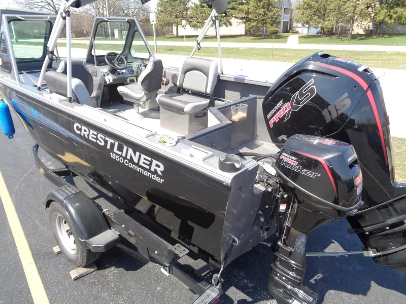 Slide: The Image of 2017 Crestliner CCM185 boat with Mercury Pro XS engine on trailer, parked outdoors. - 4