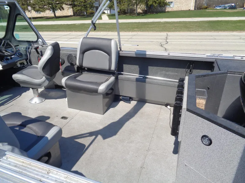 Slide: The Image of 2017 Crestliner CCM185 boat interior with seating and storage compartments. - 6