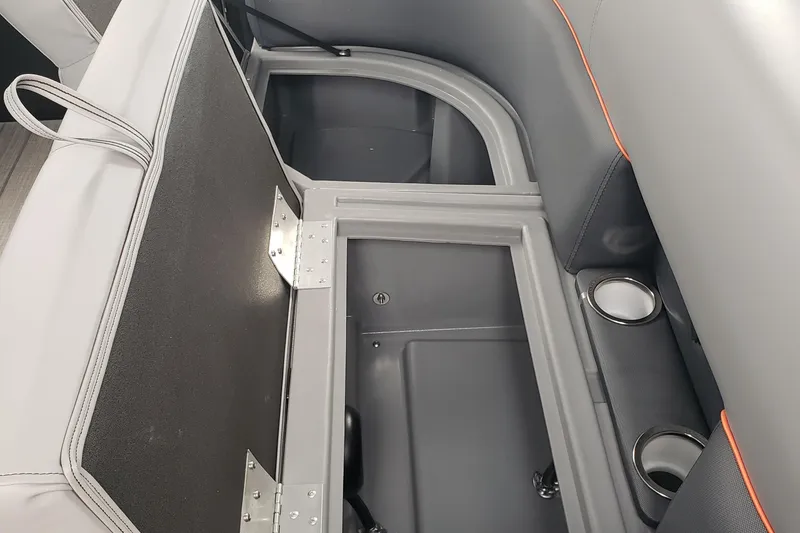 Slide: The Image of 2025 Bentley Pontoons Legacy Navigator interior storage compartment with cup holders. - 6