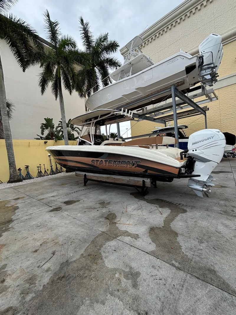 The Image of 2013 Statement 35 Center Console boat on a dock with palm trees in the background. - 1