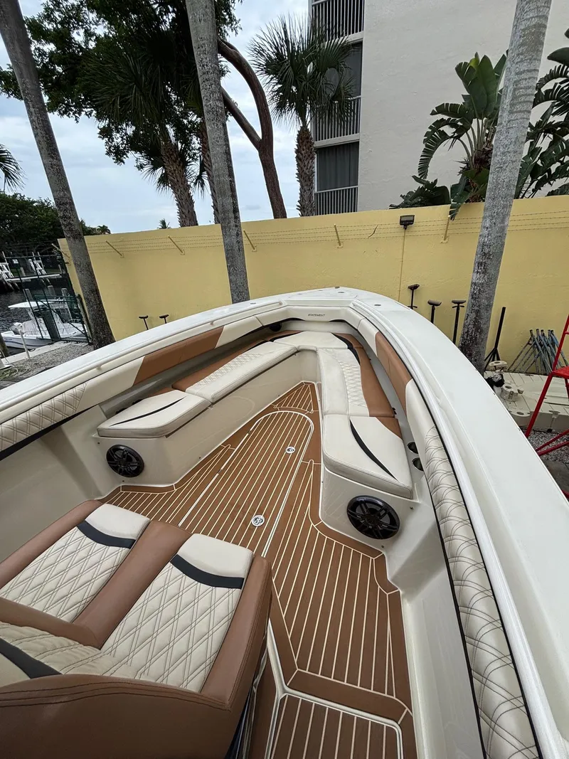 Slide: The Image of 2013 Statement 35 Center Console boat with luxurious seating and teak flooring. - 13